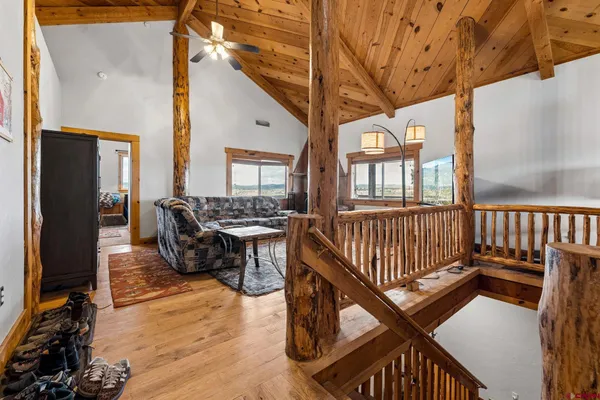 a view of living room kitchen and deck