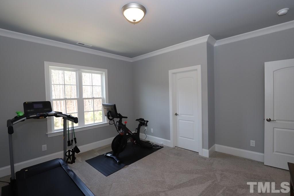 8624 Wapello Lane Raleigh, NC 27613 - Photo 23 of 26 a view of a workspace with furniture and a window