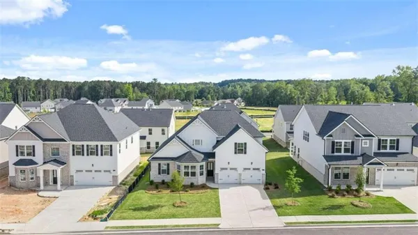 an aerial view of residential houses with outdoor space and entertaining space