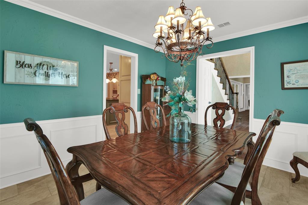 649 Anderson Road Whitesboro, TX 76273 - Photo 11 of 40 a view of a dining room with furniture and chandelier