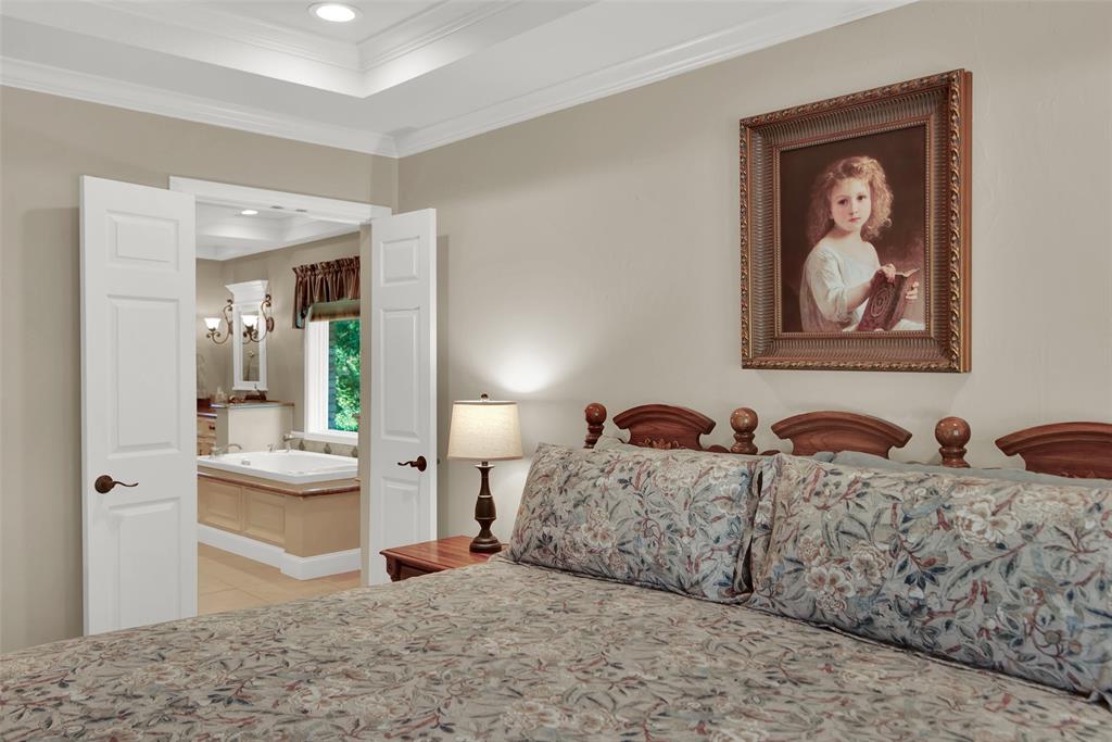 649 Anderson Road Whitesboro, TX 76273 - Photo 21 of 40 a bedroom with two beds and painting on the wall