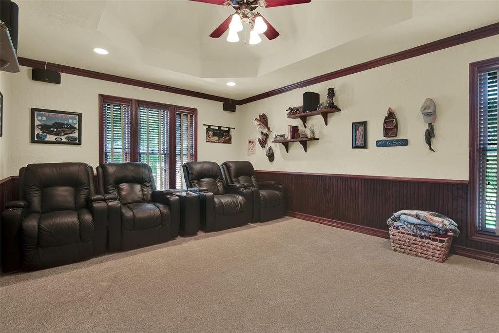 649 Anderson Road Whitesboro, TX 76273 - Photo 27 of 40 a living room with furniture a window and a ceiling fan