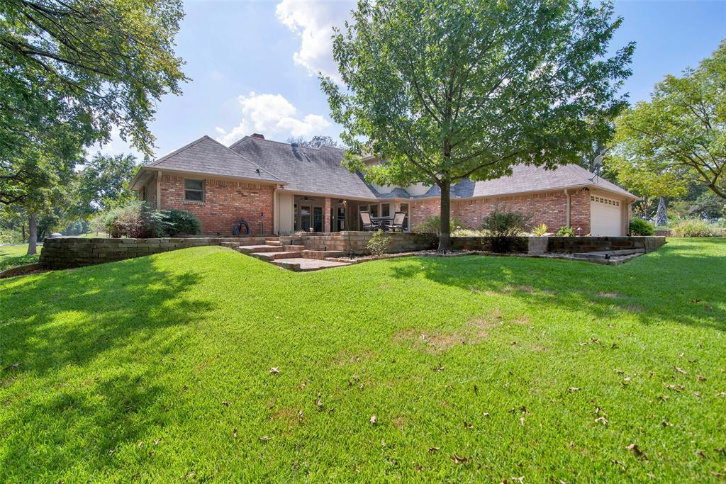 649 Anderson Road Whitesboro, TX 76273 - Photo 31 of 40 a front view of a house with garden