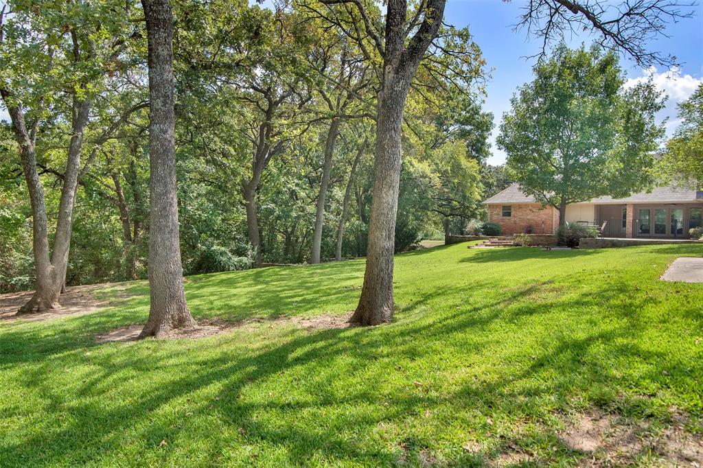 649 Anderson Road Whitesboro, TX 76273 - Photo 34 of 40 a view of a house with a yard and sitting area