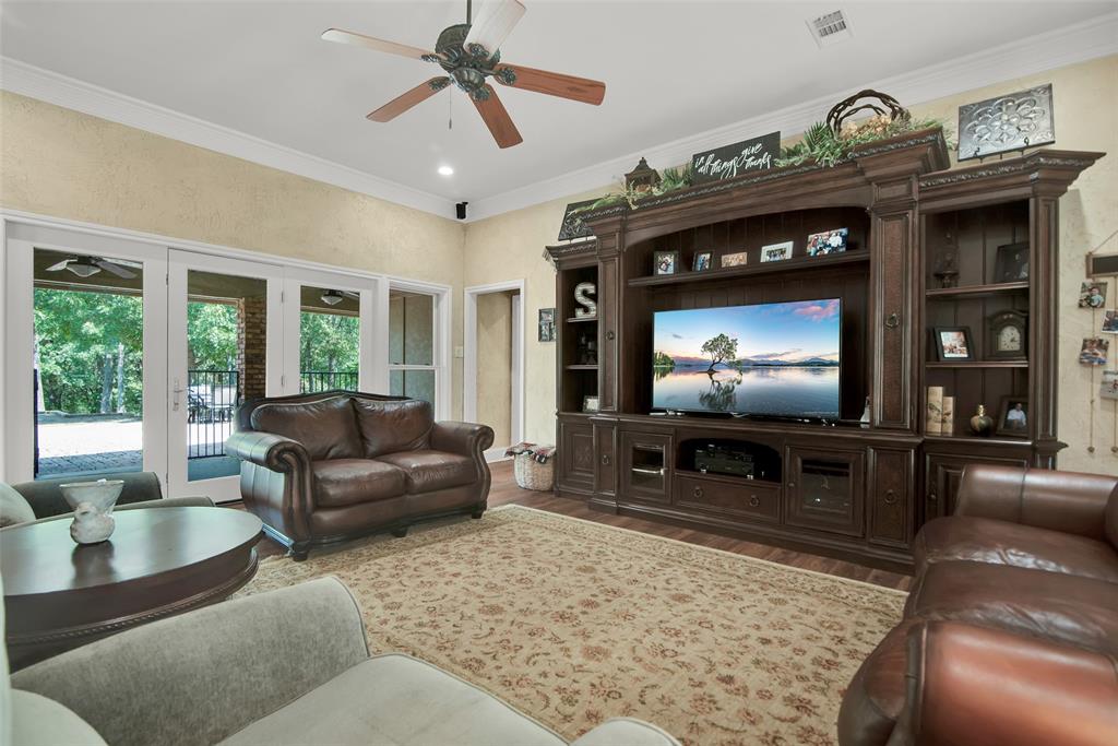 649 Anderson Road Whitesboro, TX 76273 - Photo 9 of 40 a living room with furniture and a flat screen tv