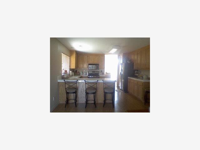 1021 Vista De Soledad Soledad, CA 93960 - Photo 2 of 5 a kitchen with a table and chairs in it