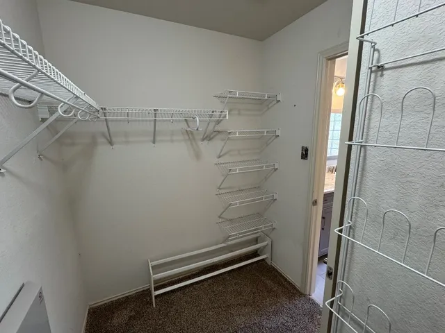 a view of a room with racks on the wall