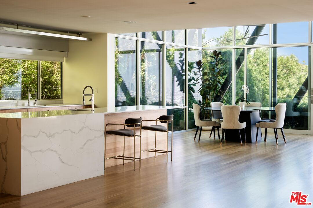 2008 Hercules Drive Los Angeles, CA 90046 - Photo 12 of 36 a dining hall with stainless steel appliances a table and chairs with wooden floor