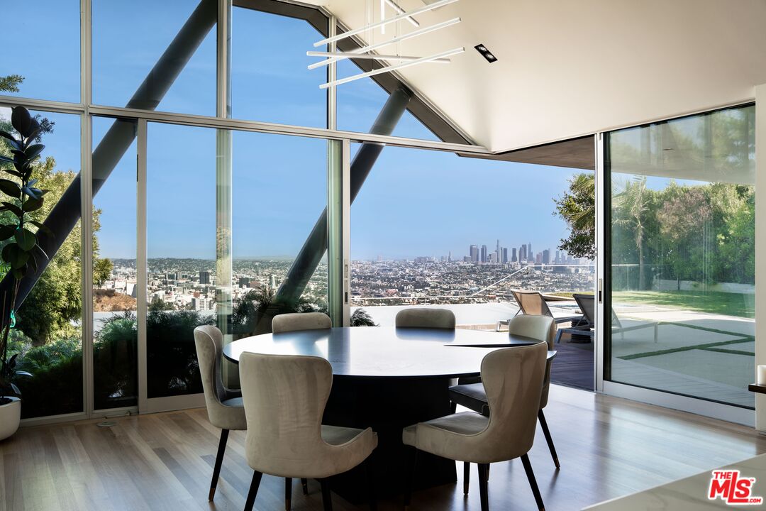 2008 Hercules Drive Los Angeles, CA 90046 - Photo 13 of 36 a view of a dining room with furniture window and wooden floor