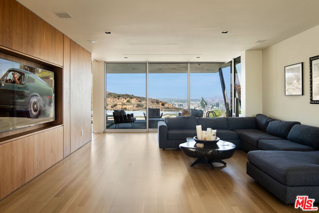 2008 Hercules Drive Los Angeles, CA 90046 - Photo 20 of 36 a living room with furniture and a fireplace