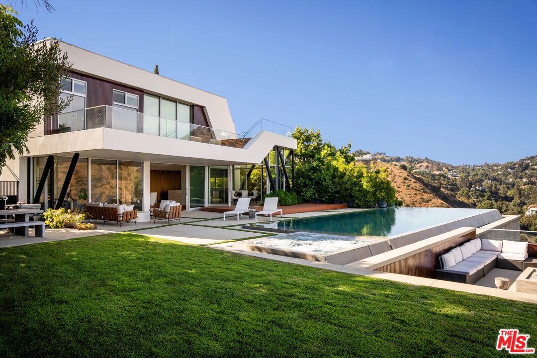 2008 Hercules Drive Los Angeles, CA 90046 - Photo 2 of 36 a view of a house with swimming pool and sitting area