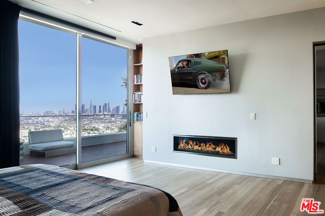 2008 Hercules Drive Los Angeles, CA 90046 - Photo 22 of 36 a bedroom with a bed and a view of kitchen