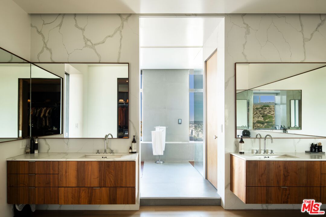 2008 Hercules Drive Los Angeles, CA 90046 - Photo 23 of 36 a bathroom with a sink and a mirror