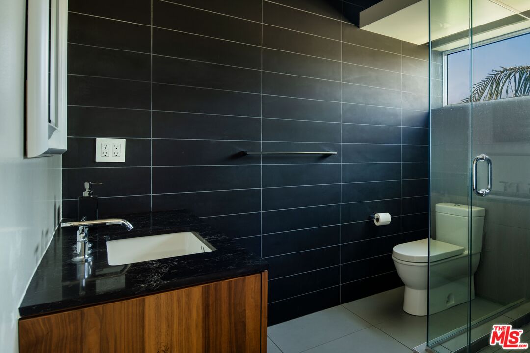 2008 Hercules Drive Los Angeles, CA 90046 - Photo 27 of 36 a bathroom with a sink and a toilet
