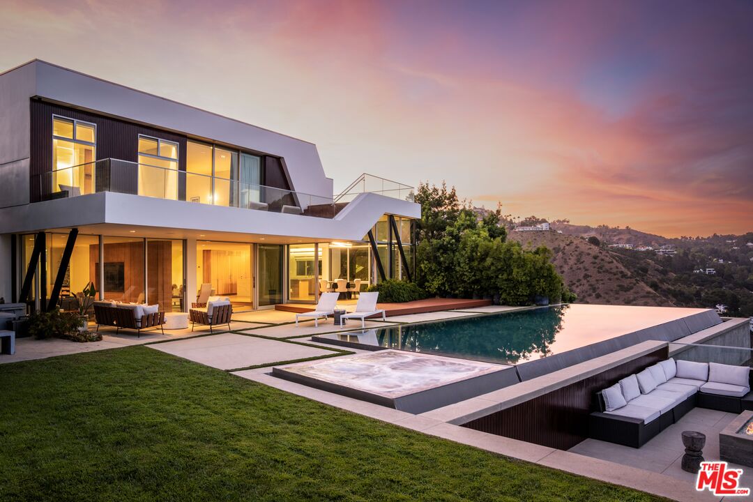 2008 Hercules Drive Los Angeles, CA 90046 - Photo 33 of 36 a front view of a house with a garden and lake view