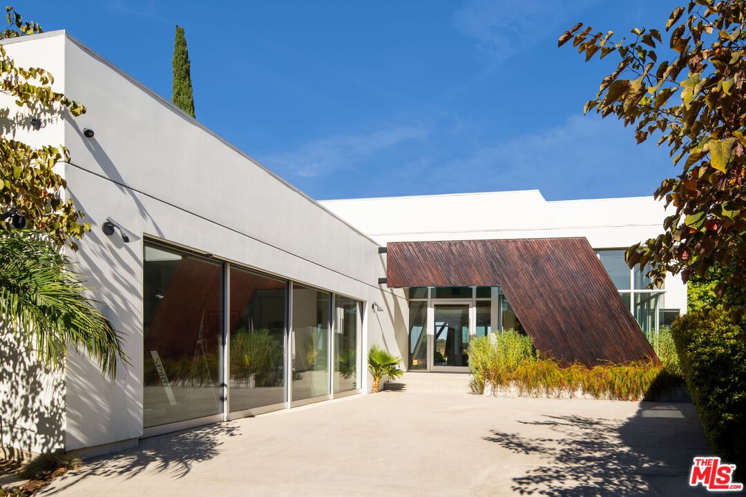 2008 Hercules Drive Los Angeles, CA 90046 - Photo 4 of 36 a view of a house with a tree in front