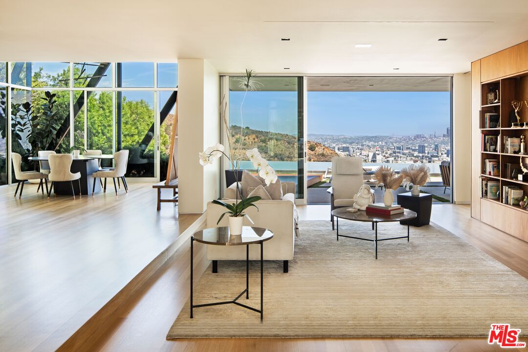 2008 Hercules Drive Los Angeles, CA 90046 - Photo 8 of 36 a living room with furniture a rug potted plant and a large window
