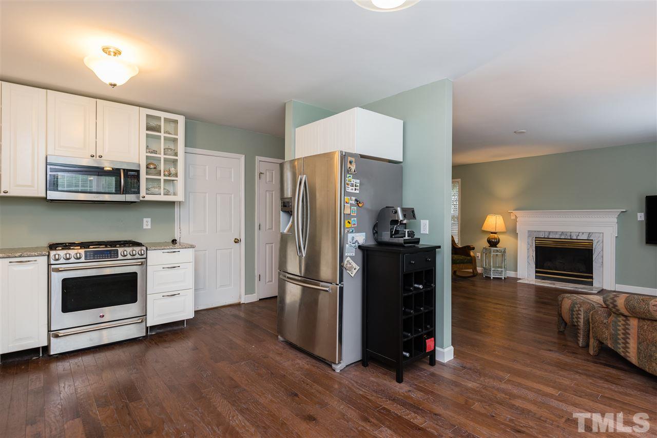 2305 Dahlgreen Road Raleigh, NC 27615 - Photo 11 of 19 a kitchen with stainless steel appliances a refrigerator stove and microwave