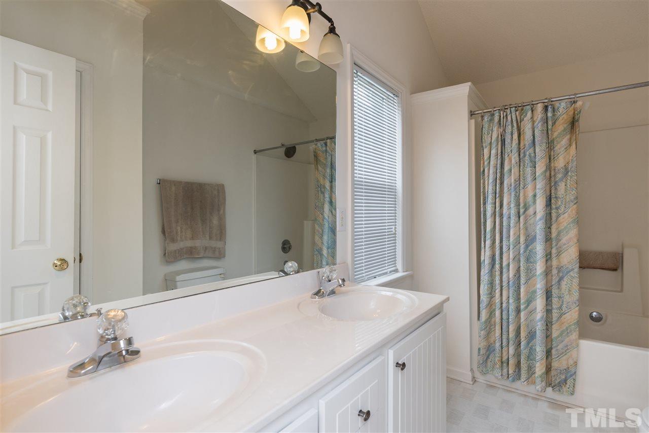 2305 Dahlgreen Road Raleigh, NC 27615 - Photo 13 of 19 a bathroom with double vanity sink and a mirror