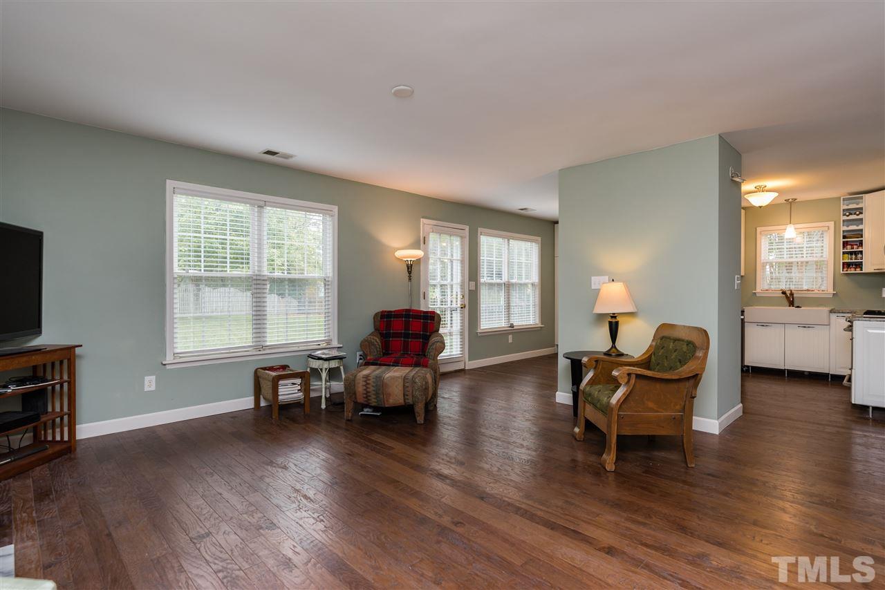 2305 Dahlgreen Road Raleigh, NC 27615 - Photo 5 of 19 a living room with furniture and a flat screen tv with wooden floor