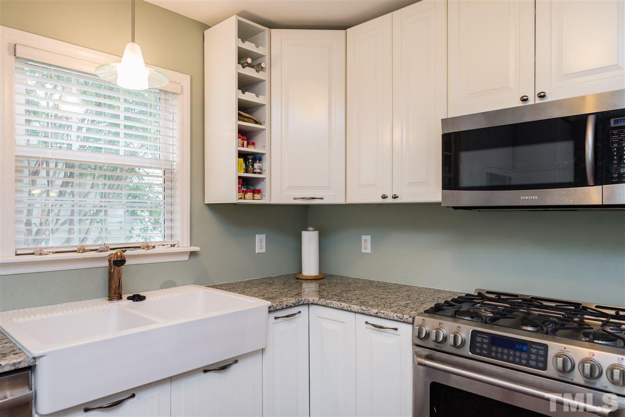 2305 Dahlgreen Road Raleigh, NC 27615 - Photo 9 of 19 a kitchen with stainless steel appliances granite countertop a sink and a stove