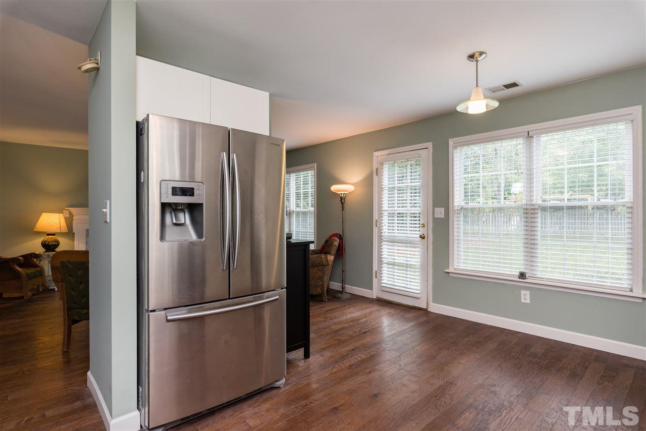 2305 Dahlgreen Road Raleigh, NC 27615 - Photo 10 of 19 a view of a kitchen with a refrigerator a sink a dishwasher and a refrigerator