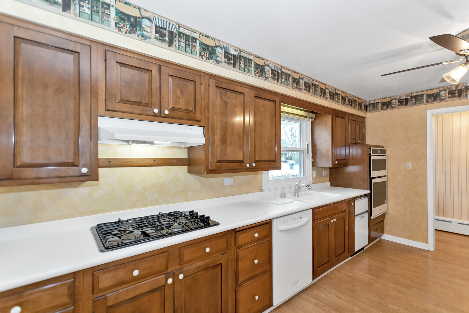 1700 Kay Road Wheaton, IL 60187 - Photo 13 of 38 a kitchen with stainless steel appliances a sink and cabinets