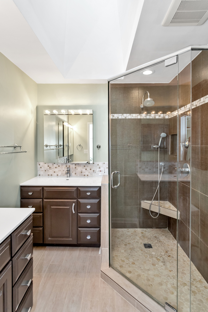 1700 Kay Road Wheaton, IL 60187 - Photo 17 of 38 a bathroom with a sink a toilet and shower