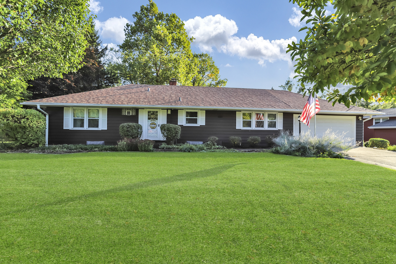 1700 Kay Road Wheaton, IL 60187 - Photo 3 of 38 a front view of a house with a garden