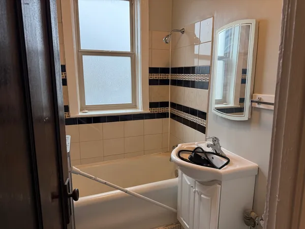a bathroom with a sink and a shower