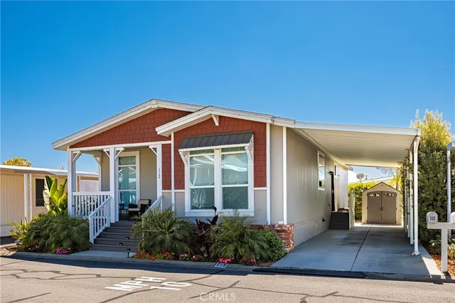 front view of a house with potted plants