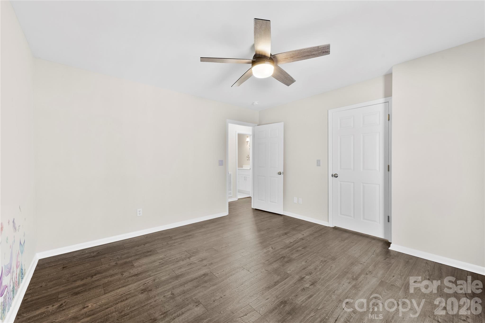 16218 Barbee Road Stanfield, NC 28163 - Photo 13 of 30 a view of an empty room with wooden floor