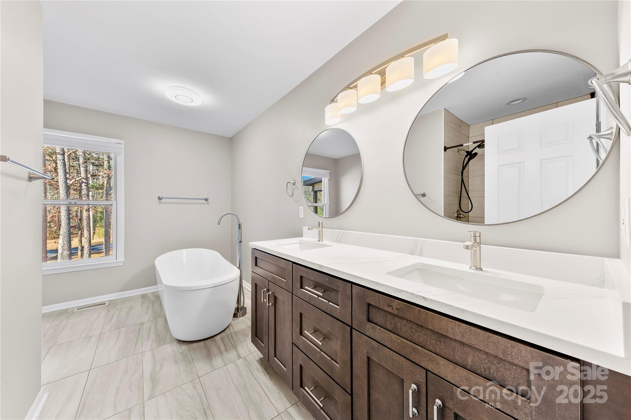 16218 Barbee Road Stanfield, NC 28163 - Photo 15 of 30 a bathroom with a sink and a mirror