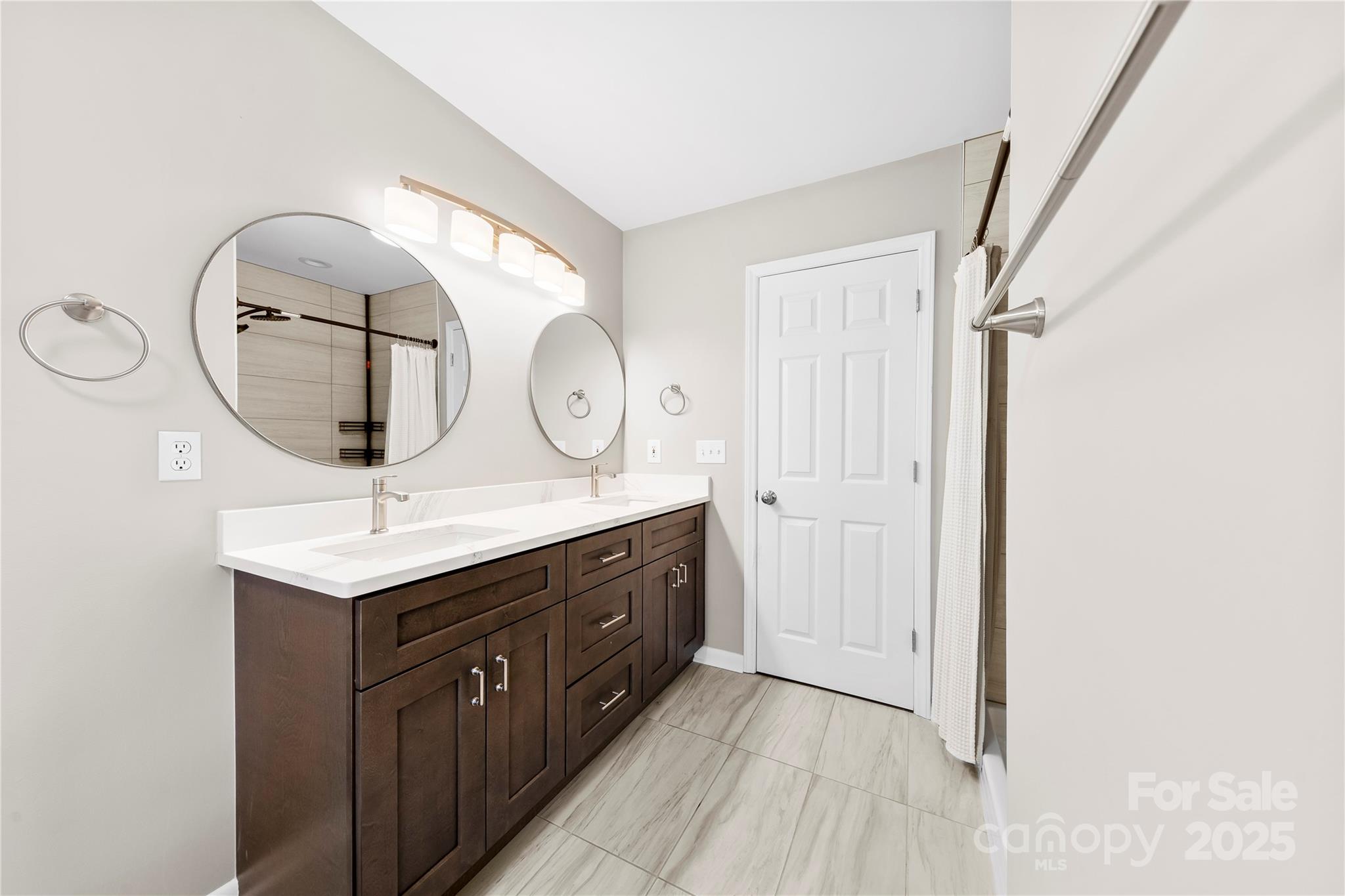 16218 Barbee Road Stanfield, NC 28163 - Photo 16 of 30 a bathroom with a sink a mirror and a shower