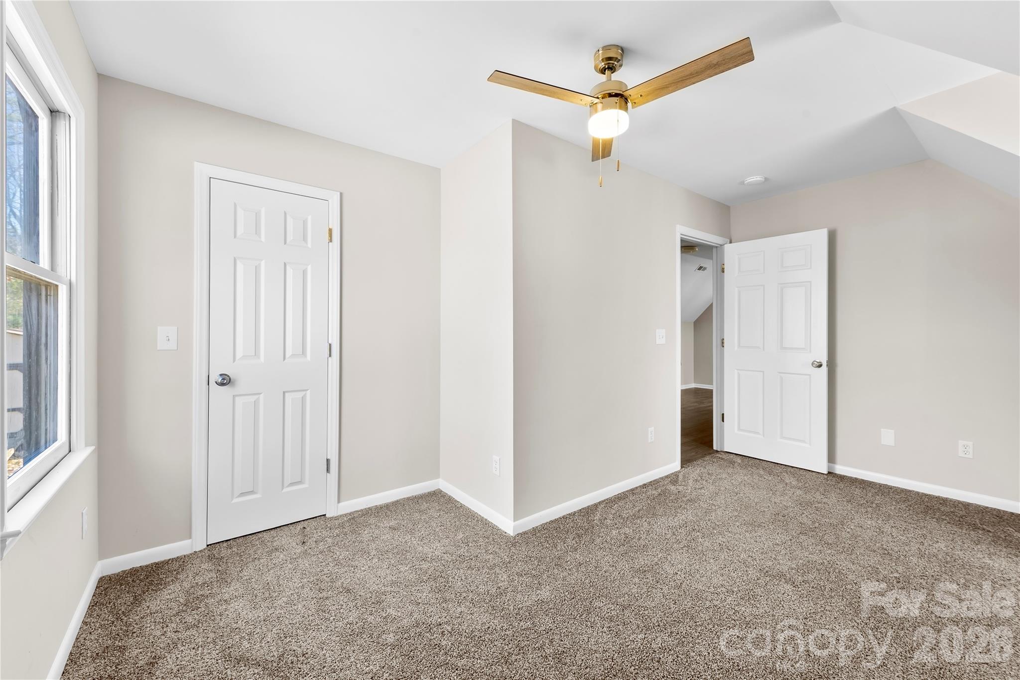 16218 Barbee Road Stanfield, NC 28163 - Photo 19 of 30 a view of an empty room with a ceiling fan