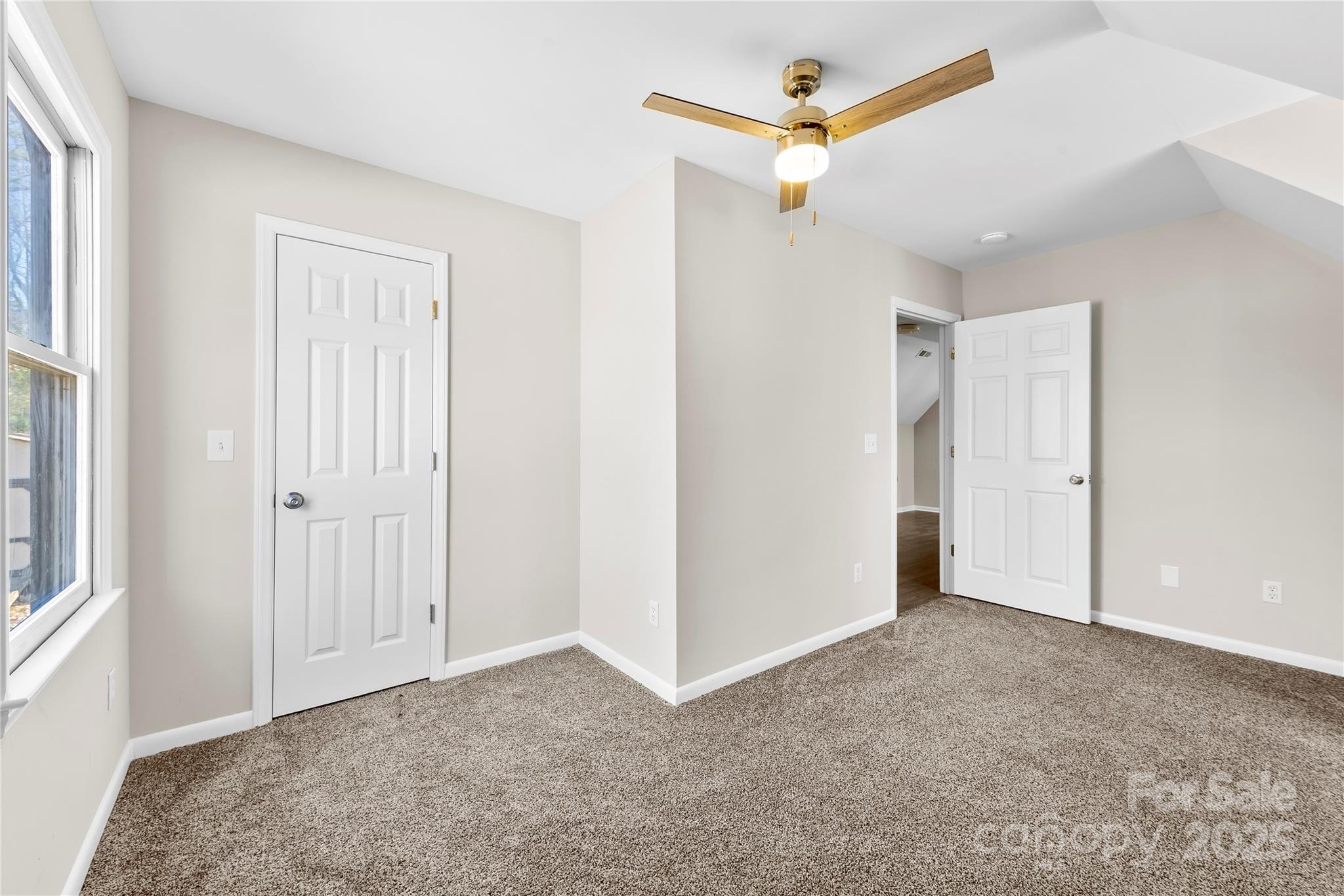 16218 Barbee Road Stanfield, NC 28163 - Photo 19 of 30 a view of an empty room with a ceiling fan