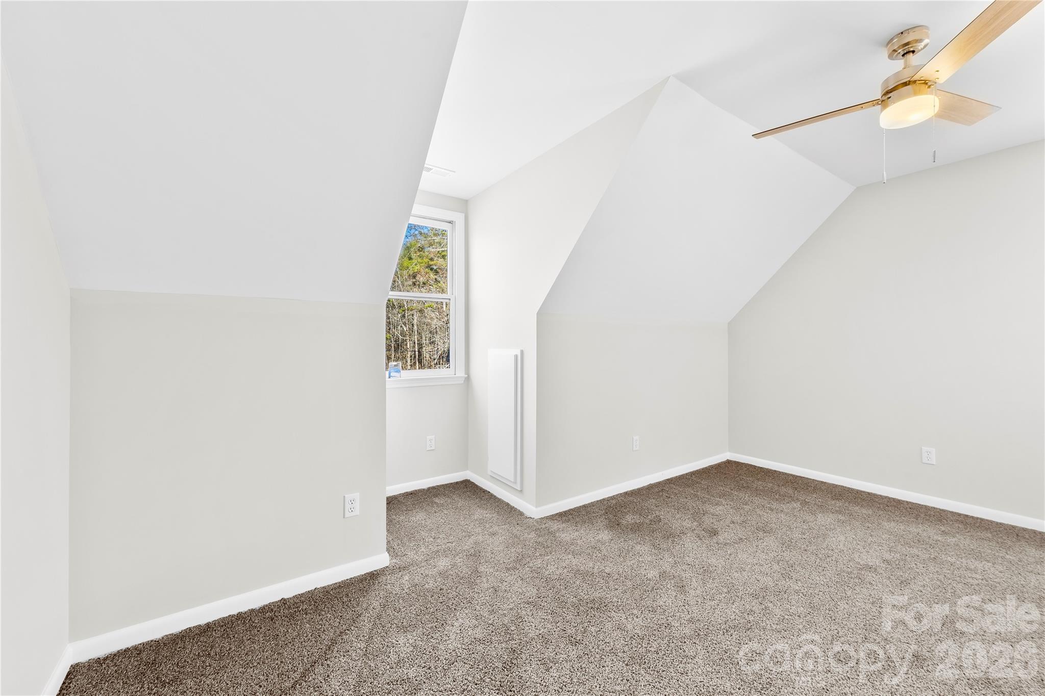 16218 Barbee Road Stanfield, NC 28163 - Photo 20 of 30 an empty room with windows and fan