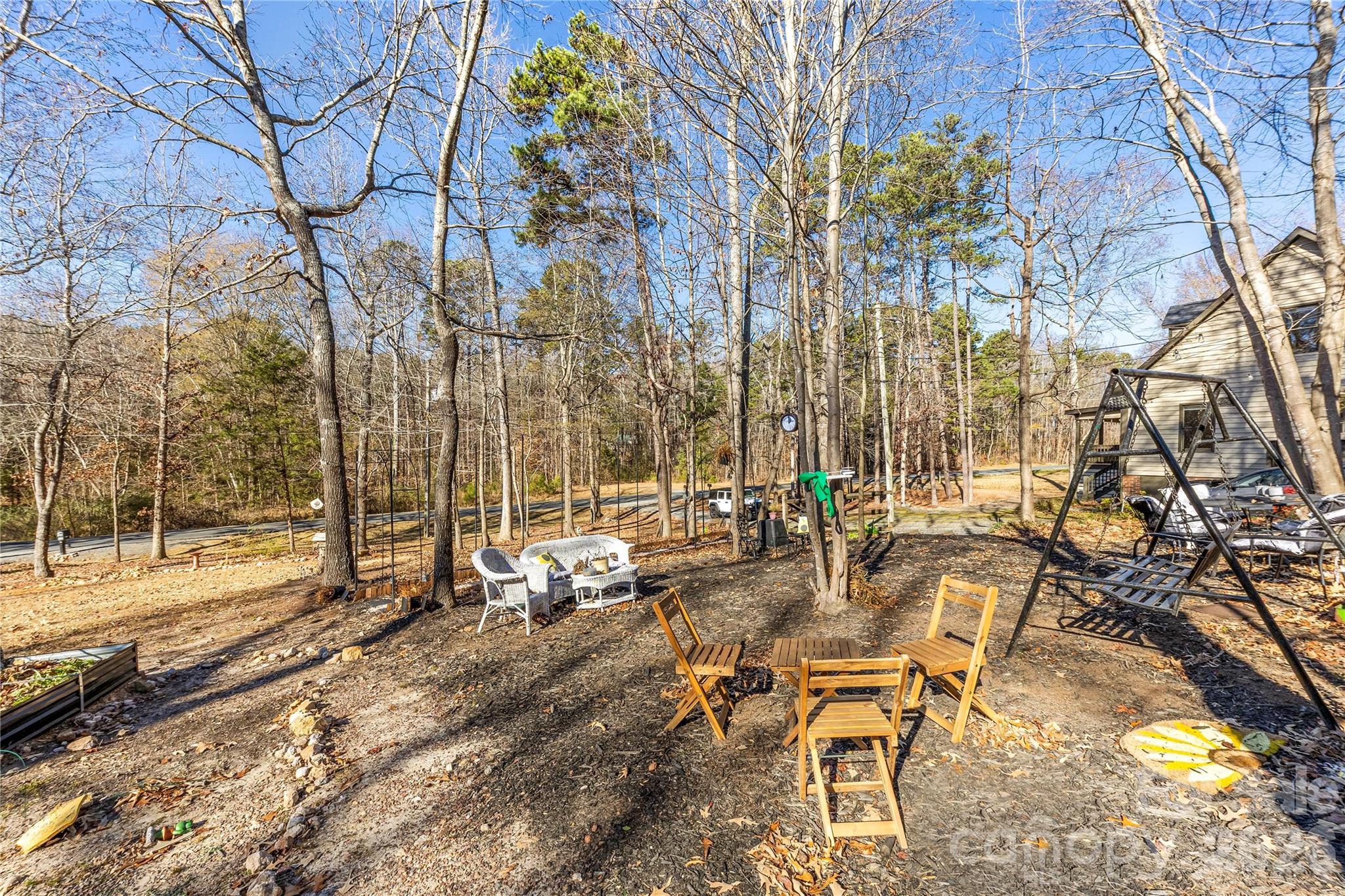 16218 Barbee Road Stanfield, NC 28163 - Photo 26 of 30 a view of a backyard with sitting area