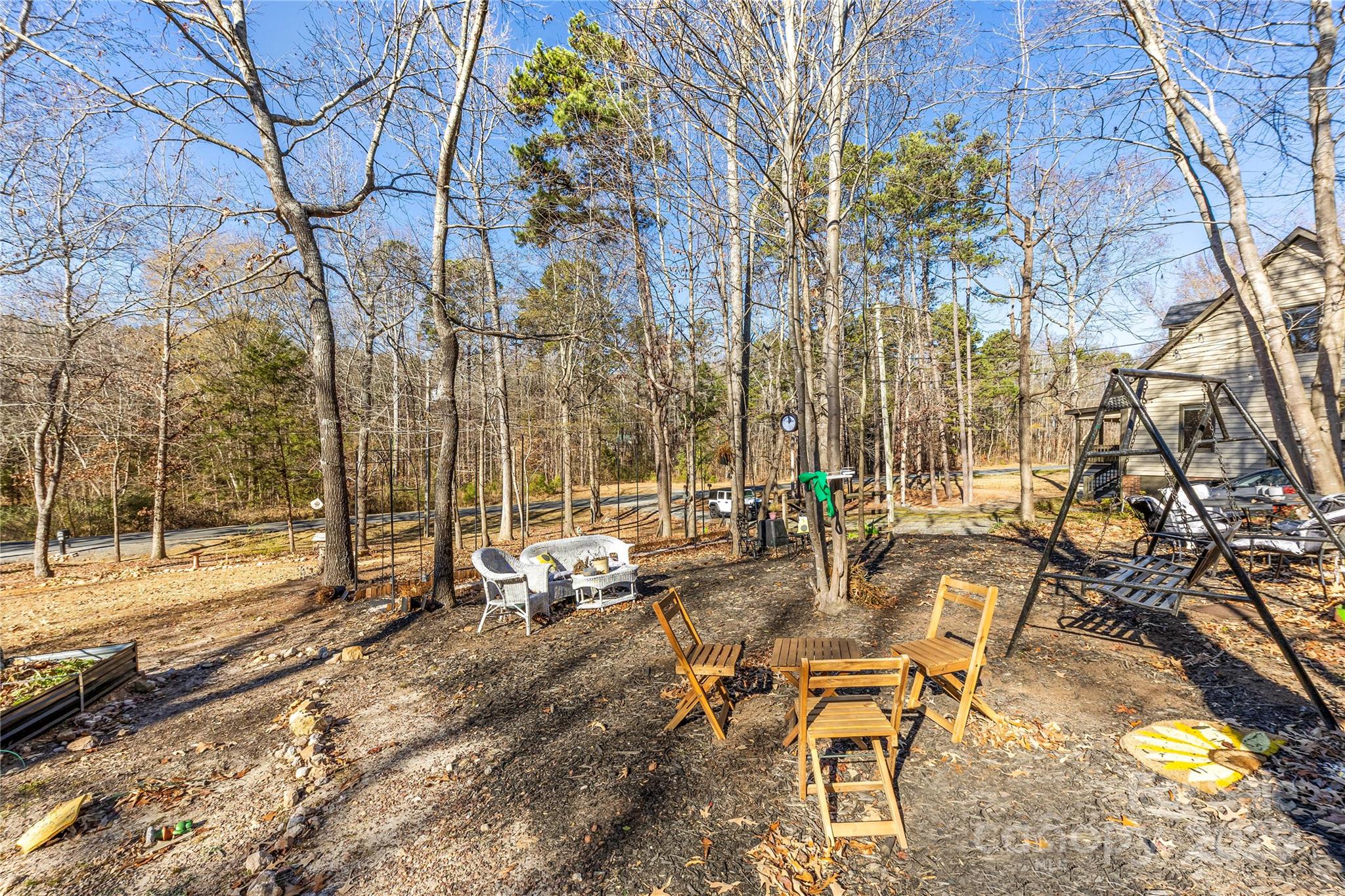16218 Barbee Road Stanfield, NC 28163 - Photo 26 of 30 a view of a backyard with sitting area