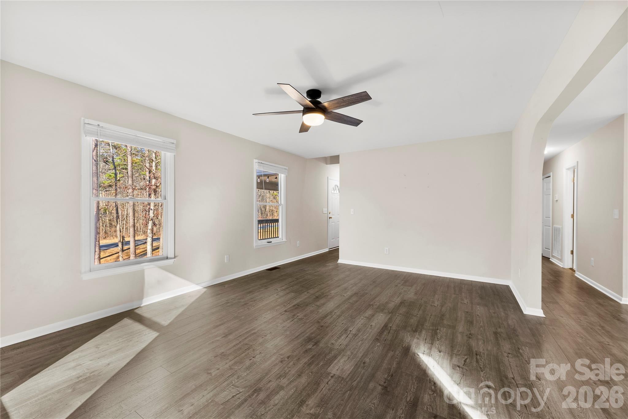 16218 Barbee Road Stanfield, NC 28163 - Photo 4 of 30 wooden floor in an empty room with a window