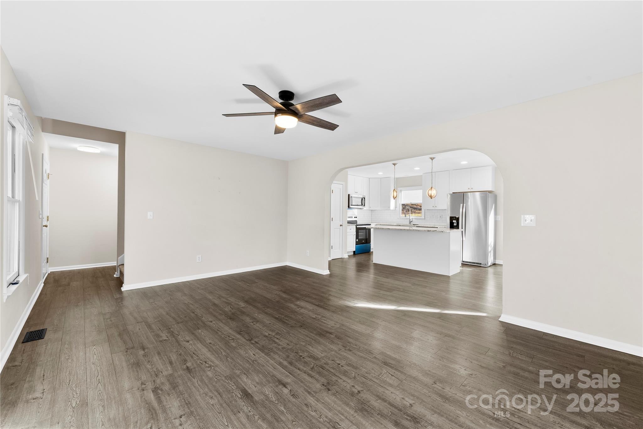16218 Barbee Road Stanfield, NC 28163 - Photo 4 of 30 a view of empty room with wooden floor