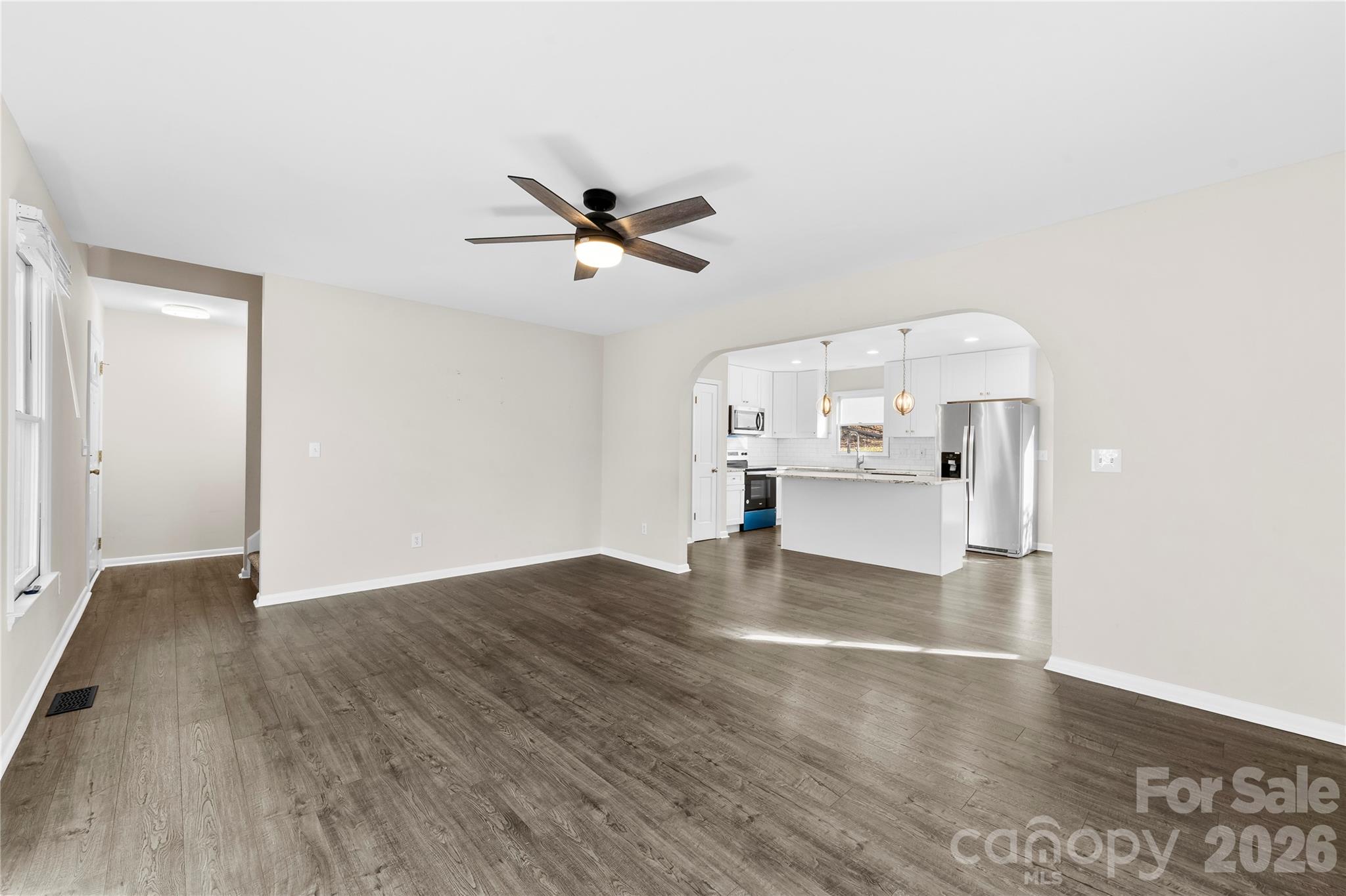 16218 Barbee Road Stanfield, NC 28163 - Photo 5 of 30 a view of empty room with wooden floor