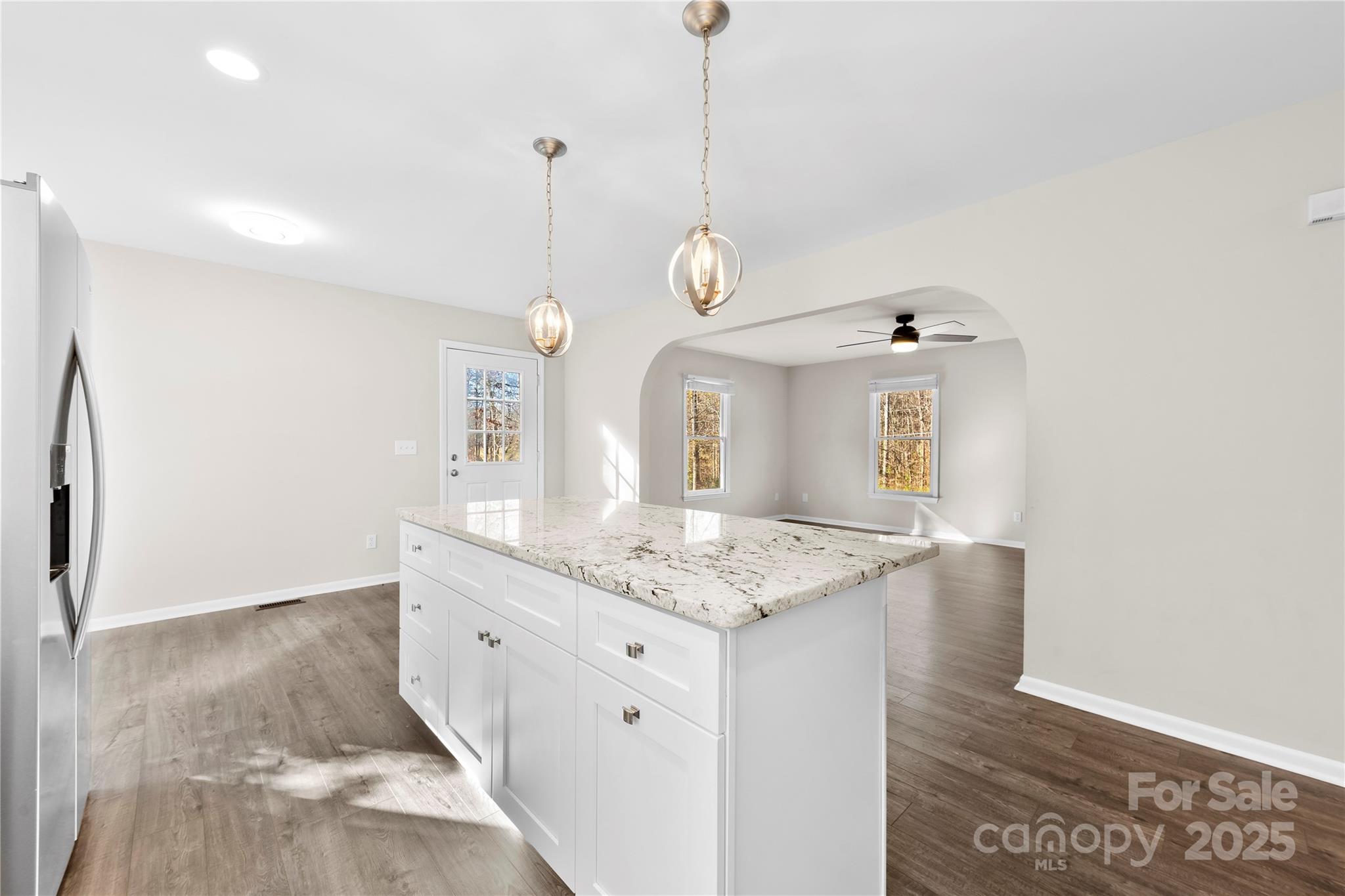 16218 Barbee Road Stanfield, NC 28163 - Photo 7 of 30 a bathroom with a granite countertop sink a mirror and a shower