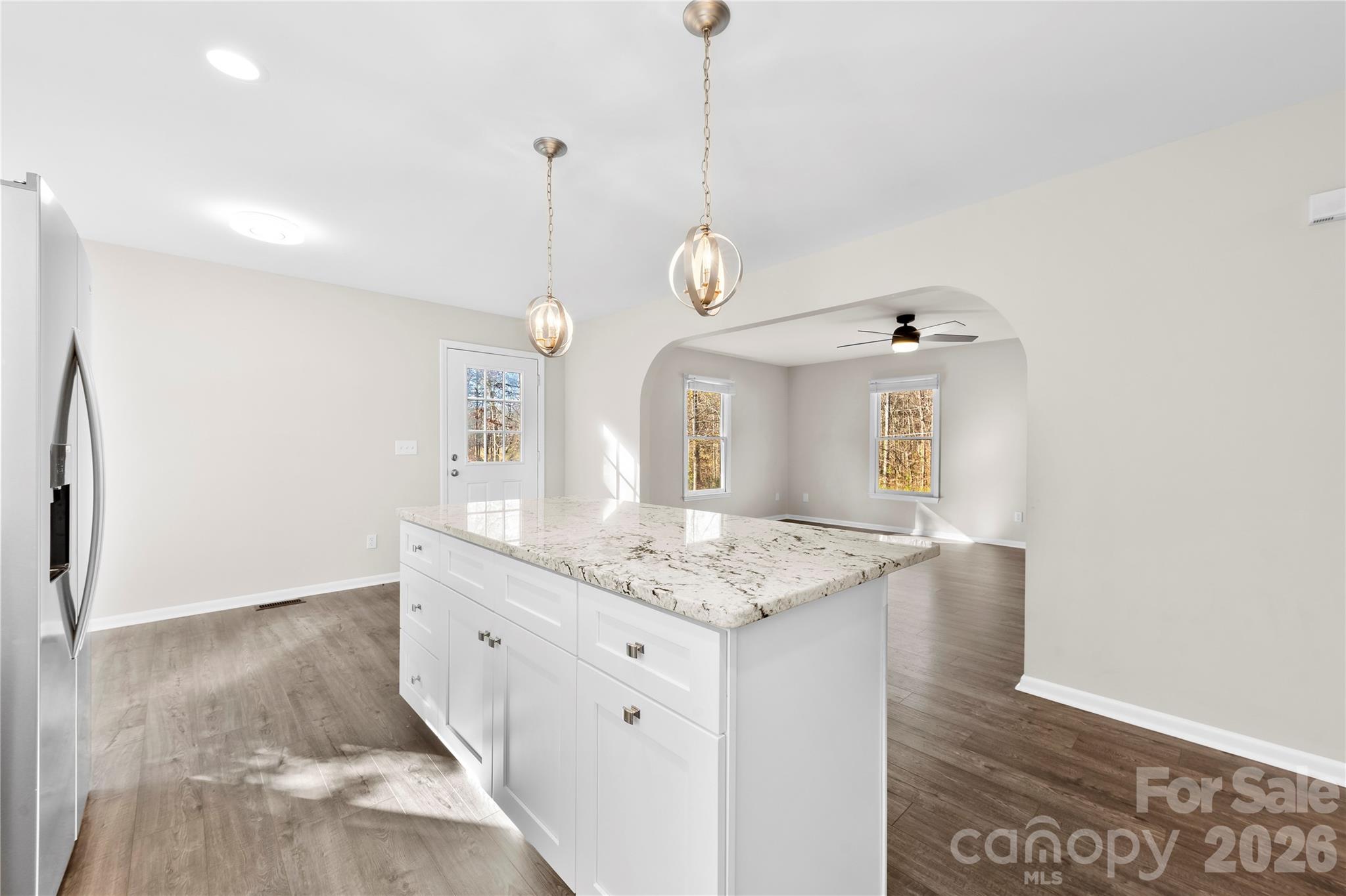 16218 Barbee Road Stanfield, NC 28163 - Photo 8 of 30 a bathroom with a granite countertop sink a mirror and a shower