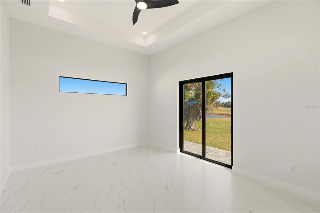 17 Long Meadow Road Rotonda West, FL 33947 - Photo 21 of 37 an empty room with windows