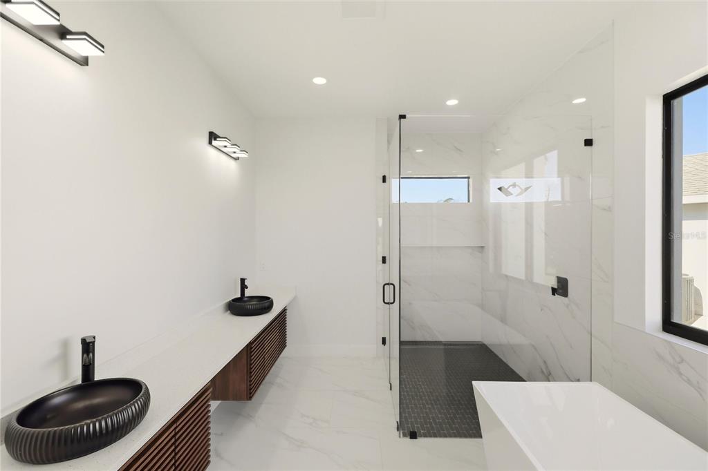 17 Long Meadow Road Rotonda West, FL 33947 - Photo 23 of 37 a bathroom with a sink a toilet and a shower