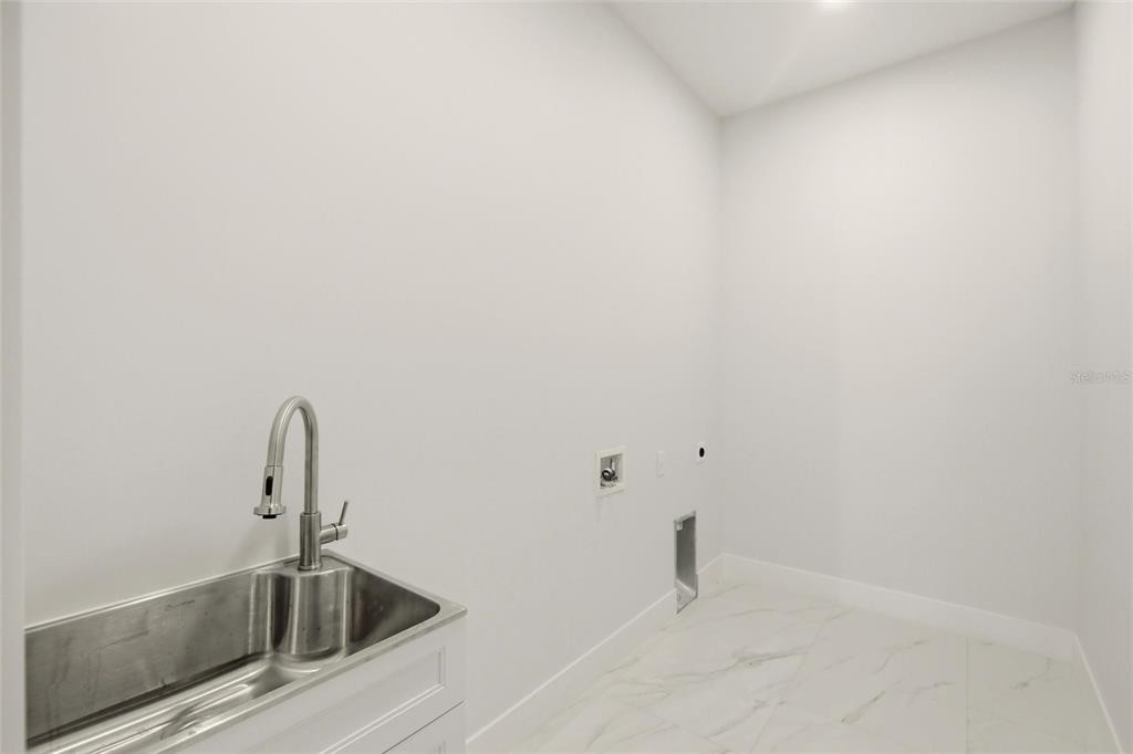 17 Long Meadow Road Rotonda West, FL 33947 - Photo 27 of 37 a bathroom with a sink and mirror