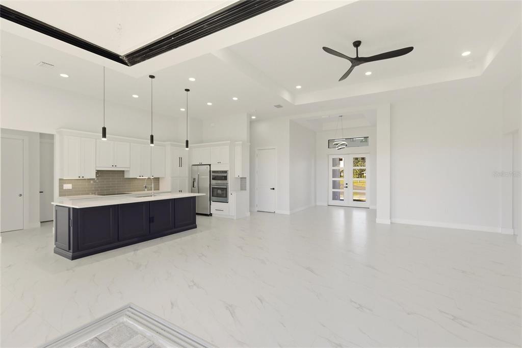 17 Long Meadow Road Rotonda West, FL 33947 - Photo 8 of 37 a large room with a large window and stainless steel appliances