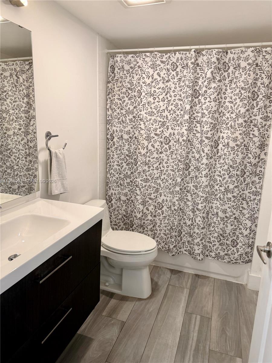 900 Southwest 8th Street, Unit 1509 Miami, FL 33130 - Photo 25 of 37 a bathroom with a sink toilet and shower
