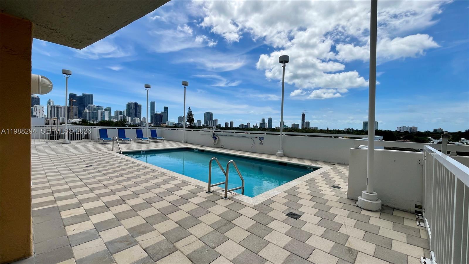 900 Southwest 8th Street, Unit 1509 Miami, FL 33130 - Photo 33 of 37 a swimming pool with outdoor seating and yard